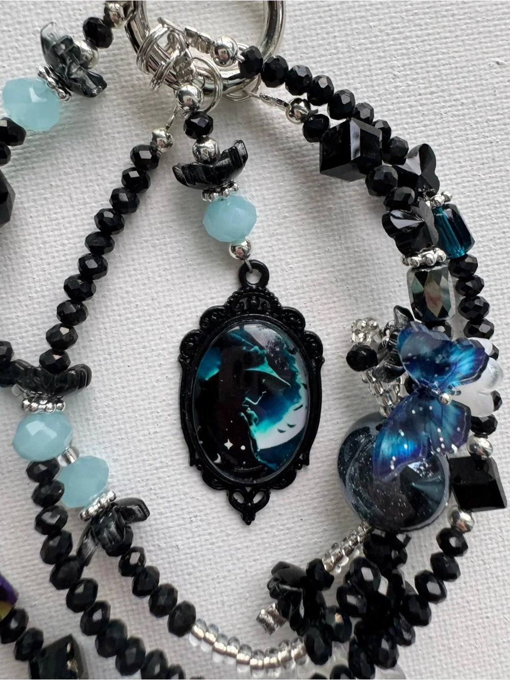 Multi-Strand Black and Teal Beaded Necklace with Blue Accent Witches Pendant